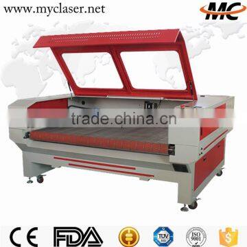 MC 1610 Top quality auto feeding fabric CO2 laser cutting machine