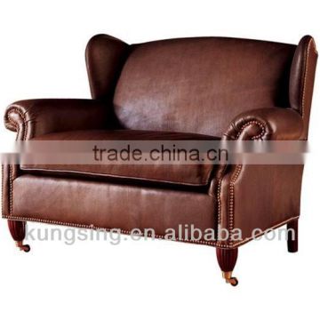 brown and beige leather sofa wing chair
