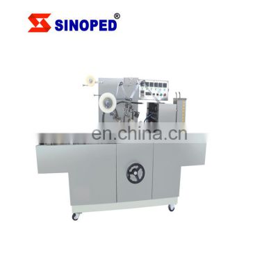 Cellophane wrapping machine for pharmaceutical food cosmetic industry use