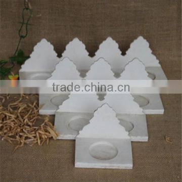 White handmade decorative craved wooden candle stand