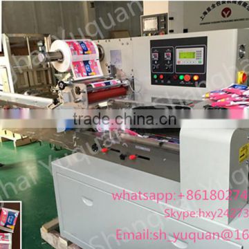Shanghai manufacture full automatic sanitary towel/wet paper tissue sealing and packing machine .
