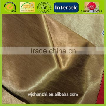 new Shinny satin finished golden nylon fabric for making luxury clothes
