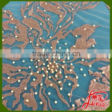 PLAIN EMBROIDERY FABRIC WITH FLORAL PEARL DECORATION