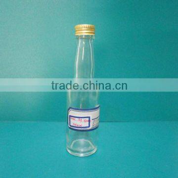 mini glass liqueur bottle with golden cap