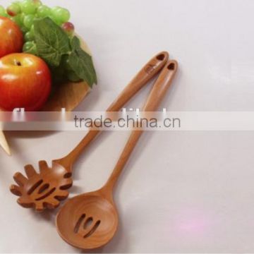China Manufacturer unique wooden kitchen gadget with wood handle