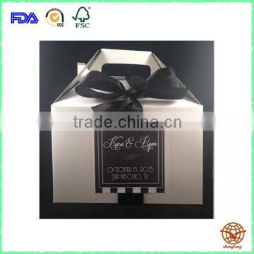 Custom bulk paperboard carrier with black Ribbon