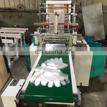 Cheap price plastic gloves machine with automatic cutting unit for hair solon,food,work shop