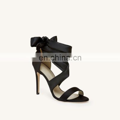 Women modeling fashion ankle strap design high heel ladies black color sandals shoes