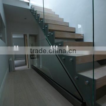 Zig-zag open stringer stairs with wood tread and glass fence