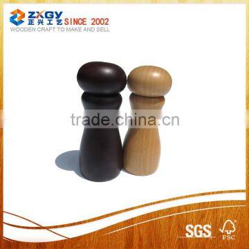 Black and natural wood pepper shakers