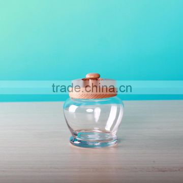 glass small jar with wooden lid in cute shape