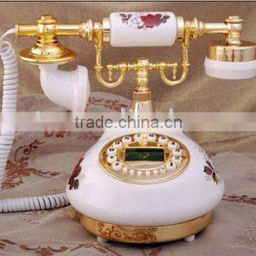 Pretty wired antique telephone with butterfly icon