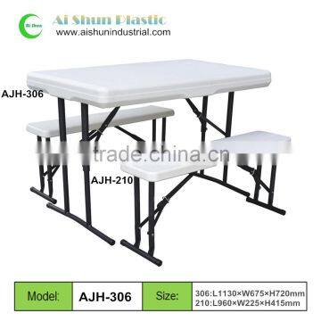 white plastic outdoor table and chair