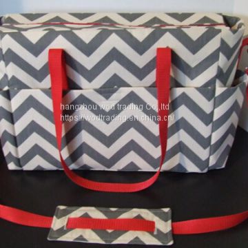Grey chevron with red trim diaper bag with adjustable cross body strap