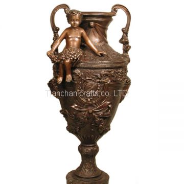 A Colorful Bronze Vase With Cherub Seated