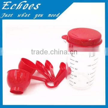 Plastic measuring cup with red measurement
