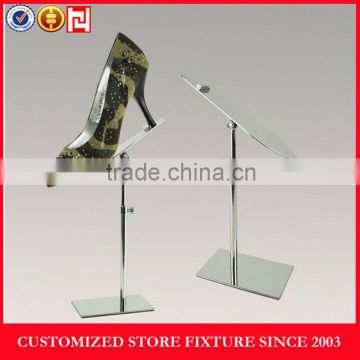 Elegant metal chromed shoe display stand