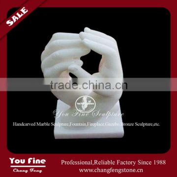 White marble carved holding hand sculpture