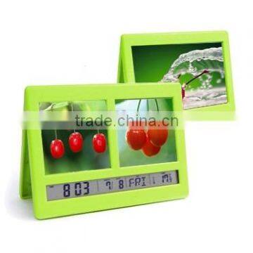 Digital alarm clock with photo frame and clip