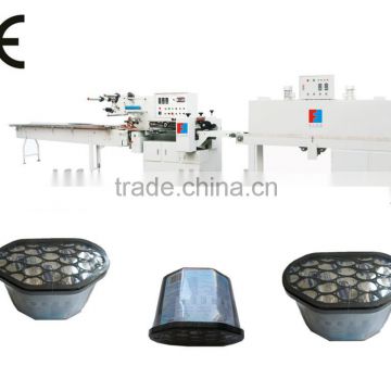 Horizontal desiccant shrink wrapping packing machine