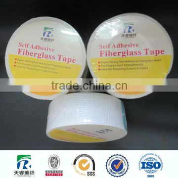 Self-adhesive fiberglass mesh tape dispenser