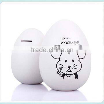 ceramic egg shaped money box with animal logo