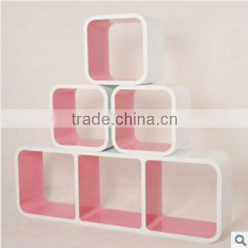 white and pink small wooden cube