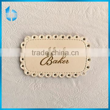 China leatherware factory produces PU synthetic leather label patch for hats
