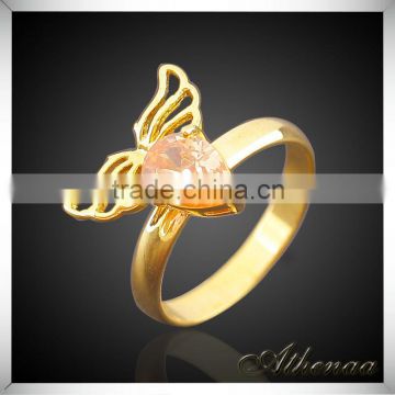 China Imported Jewelry Smooth Metal Angle Wing Red Zircon Gold Engagement Ring