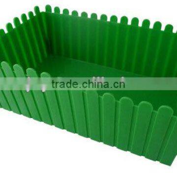 green plastic picket fence
