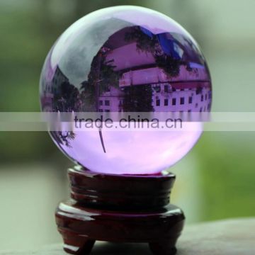 Purple crystal ball with wooden base