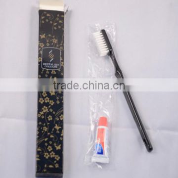 black disposable toothbrush and hotel tooth set