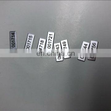 Anodized aluminum black serial number sticker
