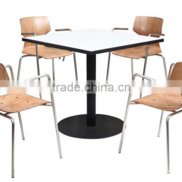 Large table with four wooden chairs for home