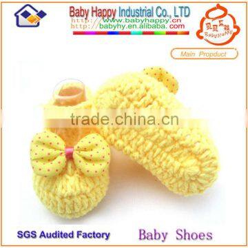 Yellow cute hand knitted baby boot