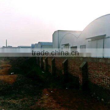 Prefabricated light steel structure warehouse with arch-shaped sloping roof