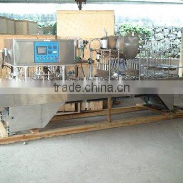 Automatic cup filling and sealing machine