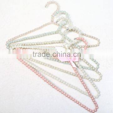 New design cheap brass pearl clothes hanger