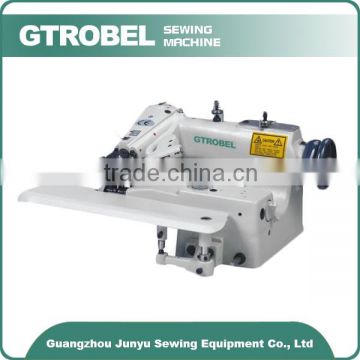 Universal blind stitch sewing machine with skip stitch device and spring-loaded rib shaft for thick fabrics
