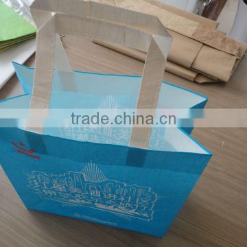 colored shopping kraft paper bag with ribbon handle