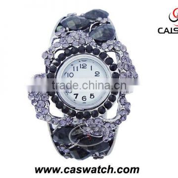 Unique ladies bangle watch with diamond and stone inserted
