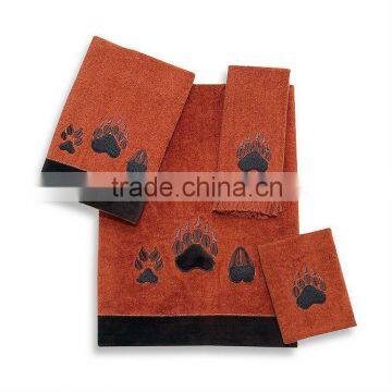 100% cotton Paw Print towel set in copper