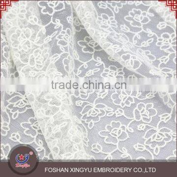 2015 latest design customized beautiful flower embroidery design white embroidered tulle fabric