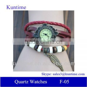 Kuntime brand Quartz watch F-05 for girls with Wing pendant,leather strap, bronzed watch case