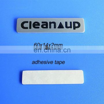 clean up logo metal plate with adhesive backed