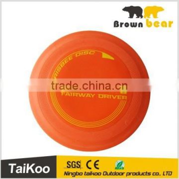 orange round rubber disc frisbee golf