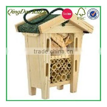 natural wooden insect hotel with asphalt shingle roof