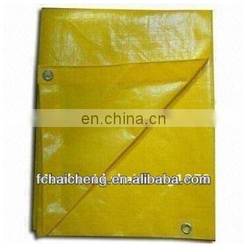 bright yellow poly tarps used in keep out/no trespassing signs