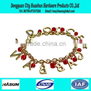 golden female charm bracelet with customizable English letters and red jewelry