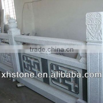 outdoor black stone railing with carving flowers